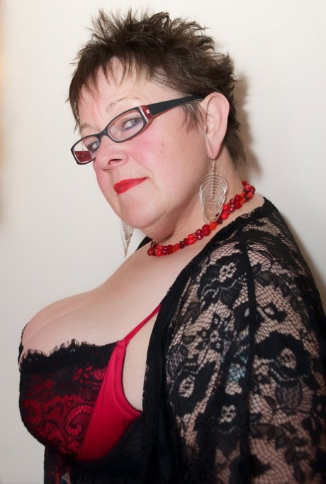 Fat older woman Warm Sweet Honey dildos her pussy in lingerie and glasses