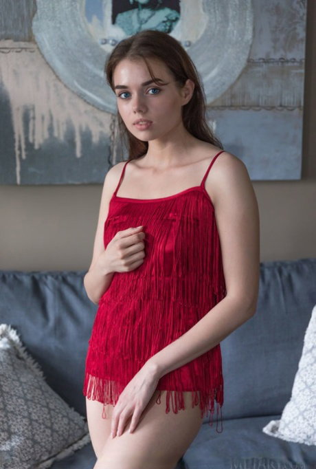 Nice teen Keira Blue uncovers her still budding boobs as she gets totally nude