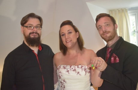 Amateur woman Sara Banks as her tits and pussy freed from a gown by two men