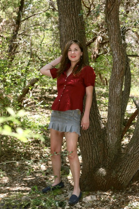 MILF Olivia Johnson removes her panties & spreads her hairy pussy outdoors