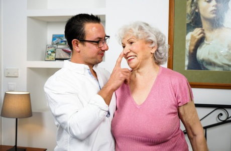 Old woman Norma B has her hairy muff licked before being banged by her toy boy