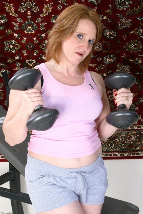 Kinky mature amateur Shawn loses her clothes & shows her cunt while exercising