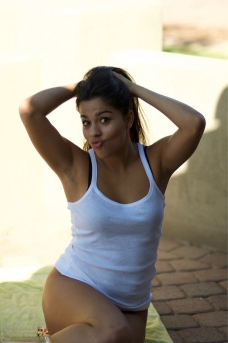Girl next door type takes a dildo to her shaved pussy while outside