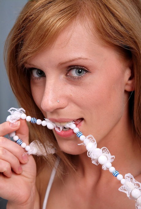 Strawberry blonde amateur Olga sticks costume jewelry up her pussy and asshole