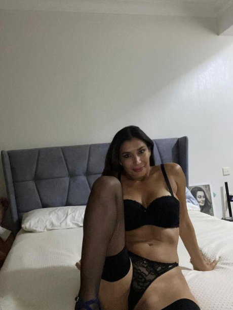 Brunette MILF Sexy Alina XXX frees her big tits before touching her pussy