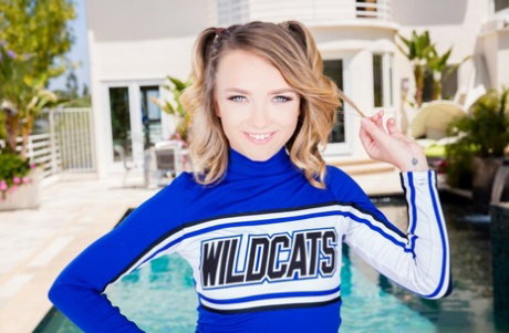Tiny girl Carmen Callaway doffs a cheerleader outfit before sex with a BBC