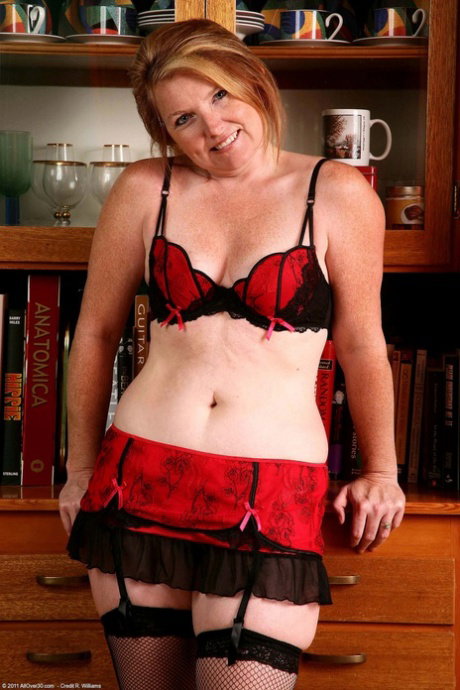 Charming mature lady Stacie slowly strips her lingerie and spreads her coochie