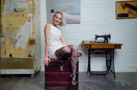 Older woman with a pleasing and firm face strips down to black stockings