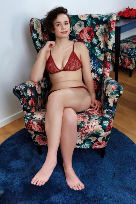 Skinny teen removes red lingerie for great nude poses on a chair