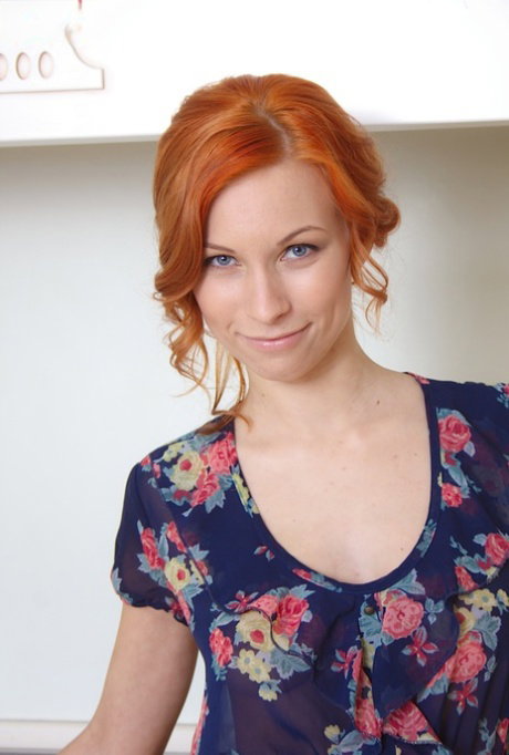 Cute redhead amateur Daisy Lee in naked upskirt spreading her pussy in kitchen