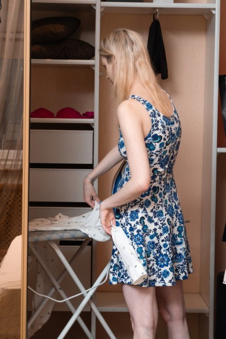 Slim blonde teen Linda Maers unveils her hairy muff slowly and rubs it