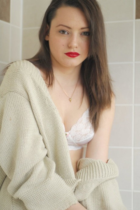 Hot babe with red lipstick Brionie W undresses & shows her curves & hairy twat