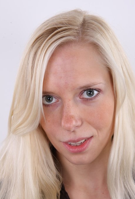 Blonde amateur exposes her mostly hairy muff for the first time