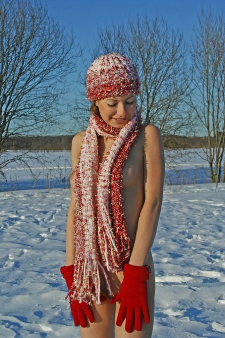Fair skinned girl Dasha G sports hard nipples during nude poses in the snow