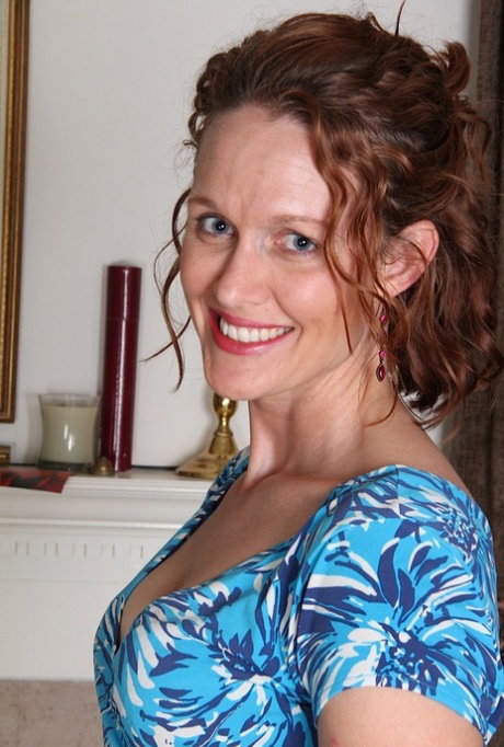 Clothed mature dame Ajia Simpson undressing for spreading of pussy