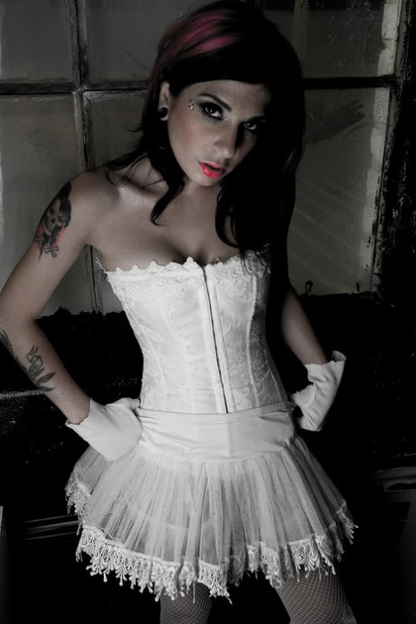 Erotic tattooed Joanna Angel in glove & white lace exposes her big breasts