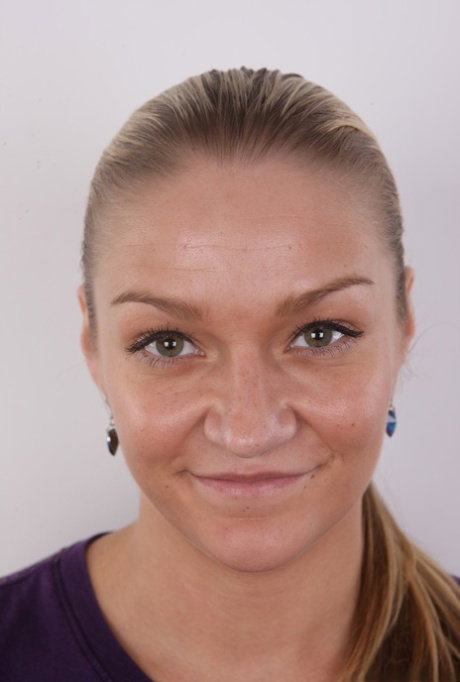 First timer Aneta stands clothed in sandals before getting totally naked