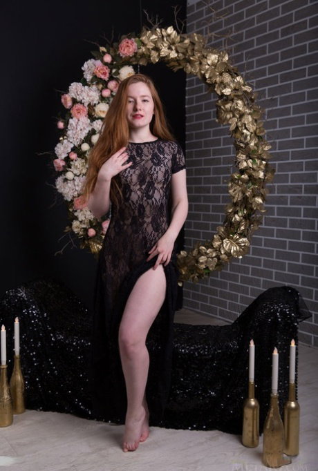 Teen solo girl with long red hair proudly shows her trimmed pussy in the nude