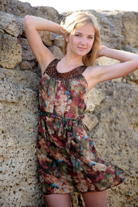 Blonde teen strips naked at ancient ruins before getting on a sailboat