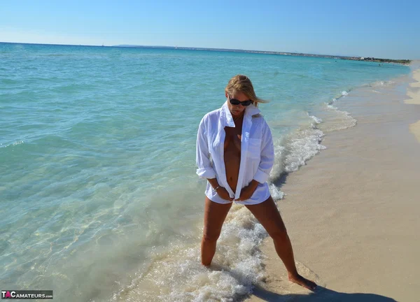 Blonde amateur Sweet Susi steps into the ocean while naked in a white shirt  - Beach, Mature, MILF, Chubby, Thick, Amateur, BBW, Curvy, Big Tits, Outdoor  - Photo 3
