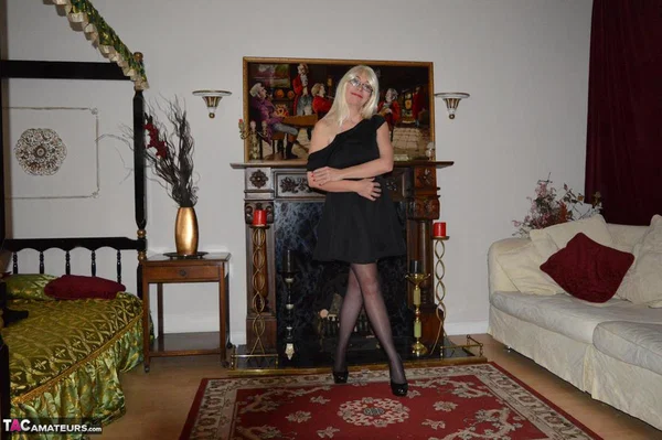 Mature blonde Barby Slut gets naked on a sofa in garters and nylons  - Mature, Glasses, Stockings, Big Tits, Amateur, Natural Tits, High Heels, Spreading, Clothed, Ass  - Photo 4
