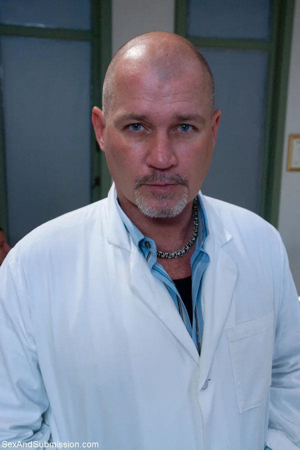 Bald doctor examines naked body of good-looking assistant in people's presence  - Brunette, Non Nude  - Photo 12
