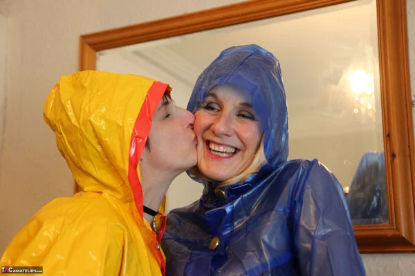 Molly MILF and her lesbian lover kiss while wearing rain suits  - Latex, Mature, Boots, Short Hair, Lingerie, Kissing, Lesbian, Stockings, Panties, Tattoo  - Photo 5