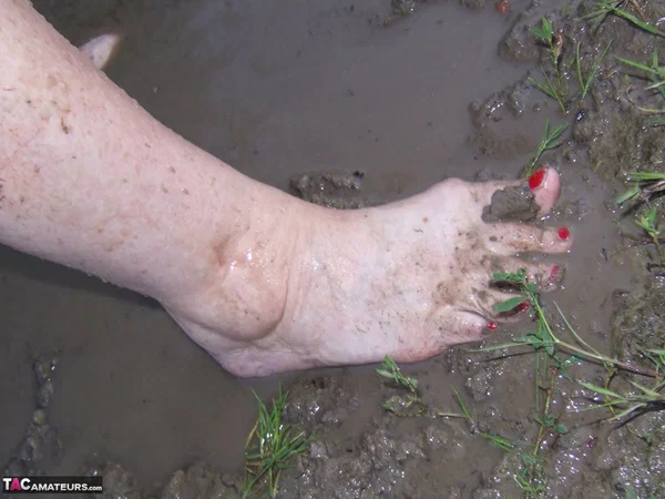 Fat nan Grandma Libby steps into a puddle before covering herself in mud  - Granny, BBW, Saggy Tits, Outdoor, Amateur, Chubby, Wet, Glasses, Curvy, Thick  - Photo 18