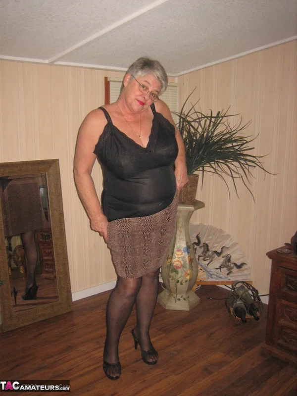 Fat granny unleashes her huge breasts before flashing no panty upskirt  - Granny, BBW, High Heels, Glasses, Stockings, Lingerie, Amateur, Short Hair, Ass, Chubby  - Photo 7