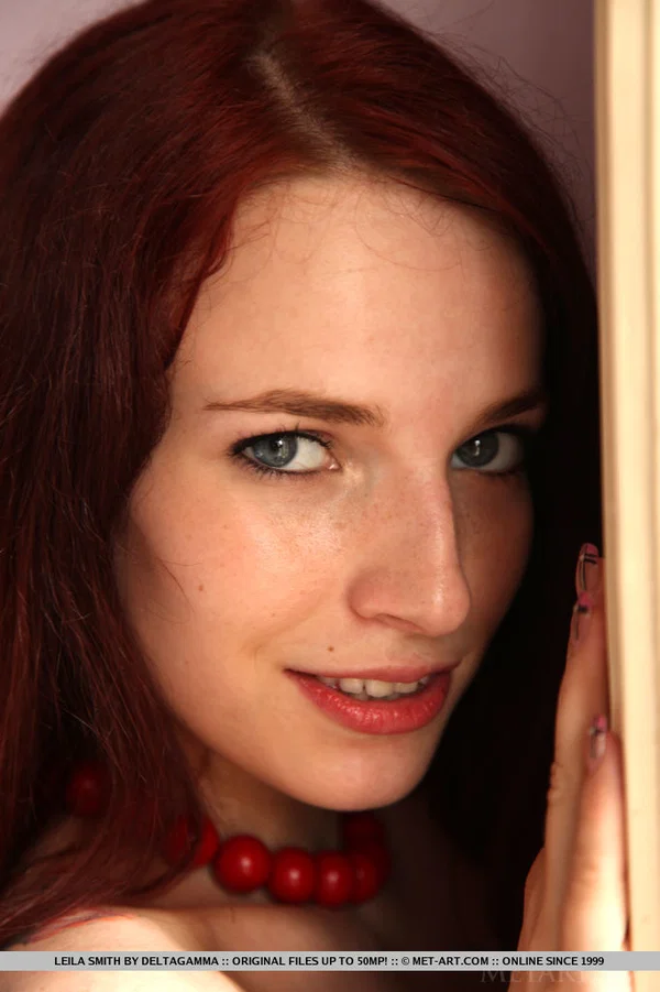Young redhead Leila Smith drapes herself in a feather boa while modeling naked  - Teen, Redhead, Spreading, Legs, Shaved, Pussy, European, High Heels, Babe, Glamour  - Photo 9