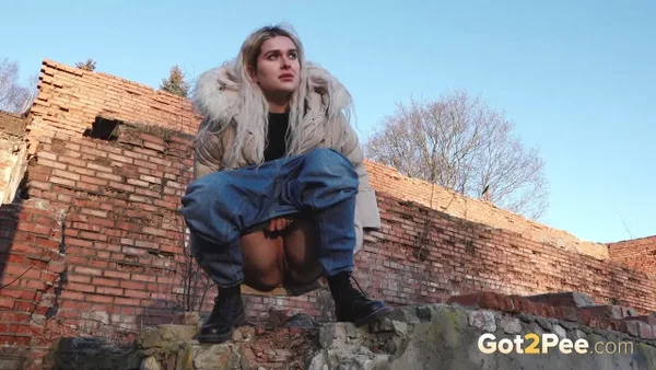 Dirty blonde Masha pulls down her jeans to take an urgent piss near a building  - Public, Pissing, Jeans, Close Up, Boots, Pussy, Outdoor, Shaved, Spreading, Non Nude  - Photo 5