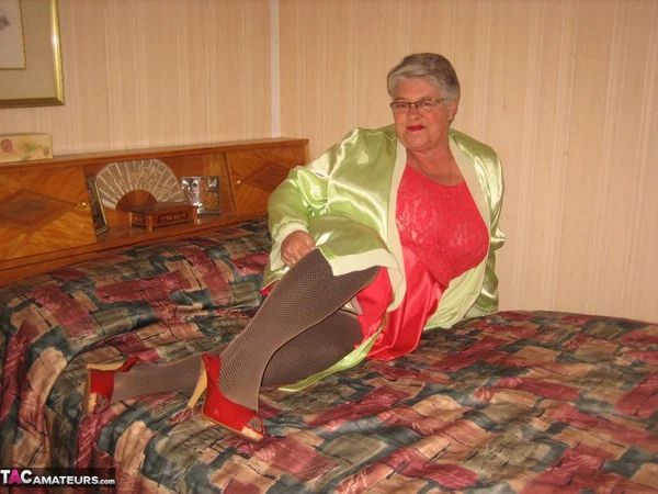 Fat granny Girdle Goddess pets her pussy after stripping to hosiery on her bed  - Granny, BBW, Stockings, Amateur, Glasses, High Heels, Clothed, Chubby, Short Hair, Curvy  - Photo 1
