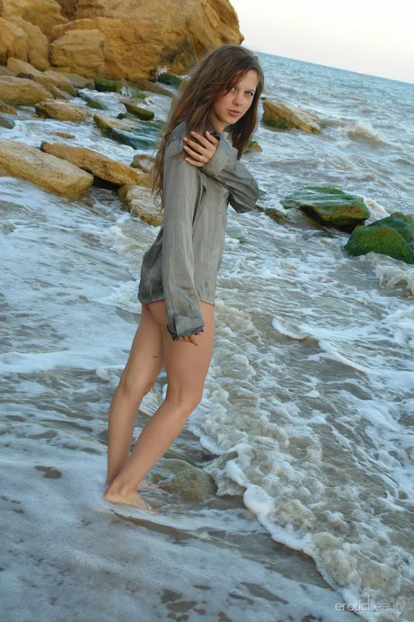 Nice teen girl Petra E removes her shirt after wading out into the ocean  - Beach, Outdoor, Teen, Wet, European, Hairy, Babe, Tiny Tits, Legs, Nipples  - Photo 2