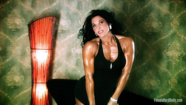 Dark haired bodybuilder Tracy Daniels shows her tight ass in upskirt mode  - Oiled, MILF, Upskirt, Clothed, Ass, PAWG, Brunette, Legs  - Photo 6