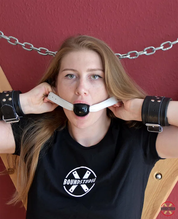 Experimental Yuly dons gags before being attached to a St Andrew's Cross  - BDSM, Bondage, Clothed, Non Nude  - Photo 2