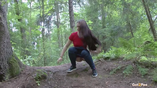 Long haired girl Lera pulls down her jeans for a piss on a bank in the woods  - Pissing, Jeans, Non Nude, Outdoor, Pussy, Hairy, Close Up, European, Babe, Undressing  - Photo 4