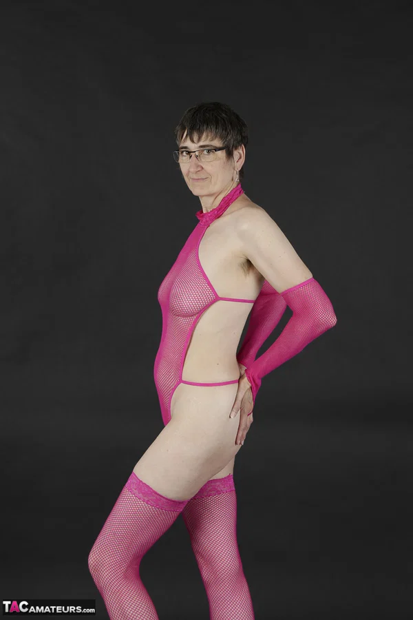 Mature amateur gets naked in pink arm socks and stockings with her glasses on  - Saggy Tits, Mature, Glasses, Short Hair, Lingerie, Amateur, Stockings, Brunette, European  - Photo 2