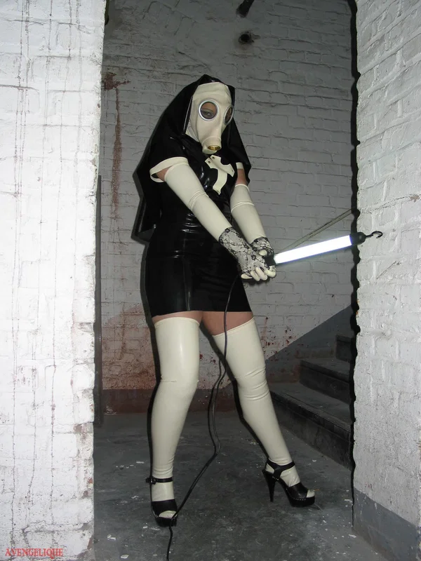 Solo model Avengelique sports a gas mask while wearing latex Nun clothing  - Nun, Latex, Skirt, Fetish, Uniform, Stockings, Clothed, High Heels, PAWG, Legs  - Photo 14