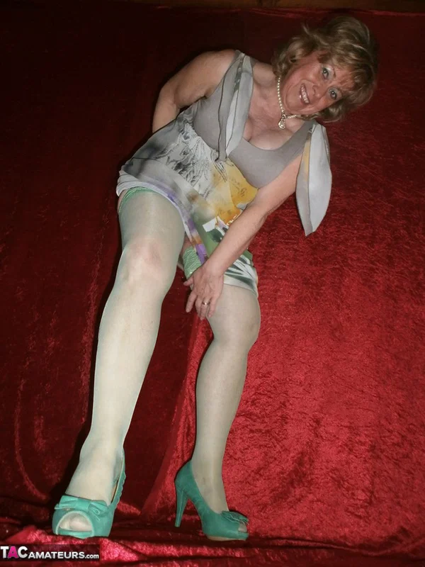 Chubby mature granny Caro in green stockings flashes lace panty cameltoe  - Granny, BBW, Amateur, Stockings, Panties, Big Tits, High Heels, Curvy, Chubby, Thick  - Photo 3