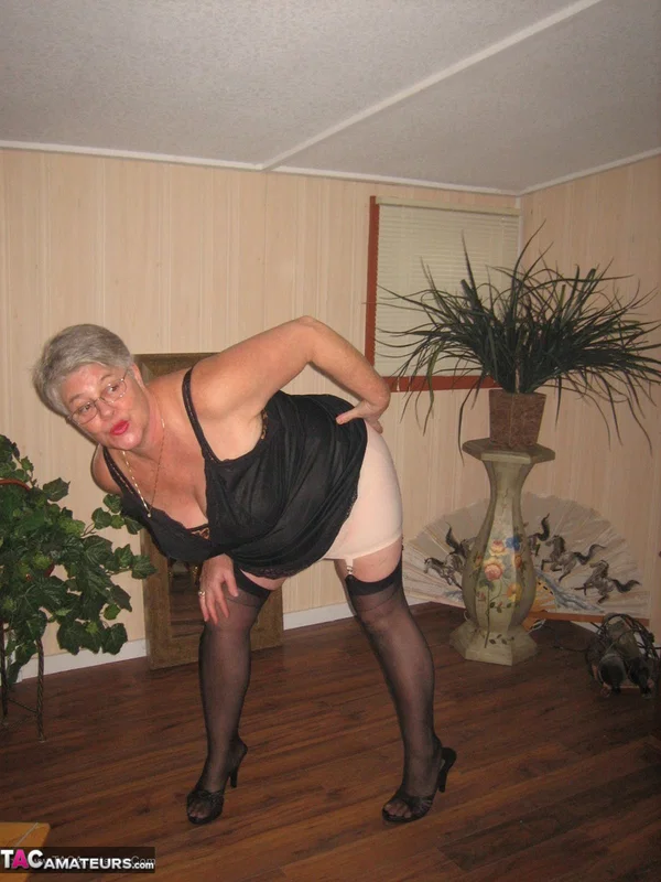 Fat granny unleashes her huge breasts before flashing no panty upskirt  - Granny, BBW, High Heels, Glasses, Stockings, Lingerie, Amateur, Short Hair, Ass, Chubby  - Photo 11