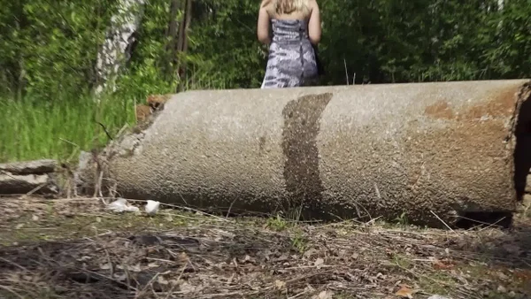 White girl Diana takes a piss near the woods while sitting on a length of pipe  - Pissing, Spreading, Pussy, Outdoor, Skirt, Close Up, Babe, Beautiful, Solo, European  - Photo 15
