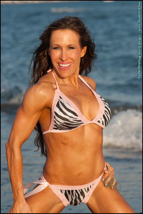 Bodybuilder Tammi Bradford poses on a beach while wearing a bikini  - Sports, Beach, Bikini, Beautiful, MILF, Big Tits, Outdoor, Brunette, Babe, Undressing  - Photo 15