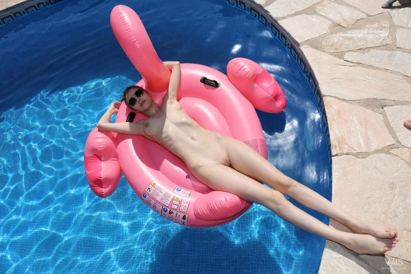 Sweet teen girl with big natural tits show her bald twat on an inflatable swan  - Bikini, Skinny, Pool, Outdoor, Teen, Pussy, Shaved, Glamour, Spreading, Ass  - Photo 16