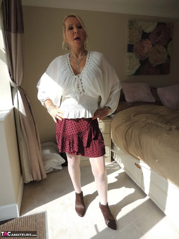 Mature blonde Emerald frees her big tits after playing with her vagina  - Mature, Stockings, Clothed, Upskirt, Lingerie, Amateur, Big Tits, Skirt, Pussy, Panties  - Photo 1