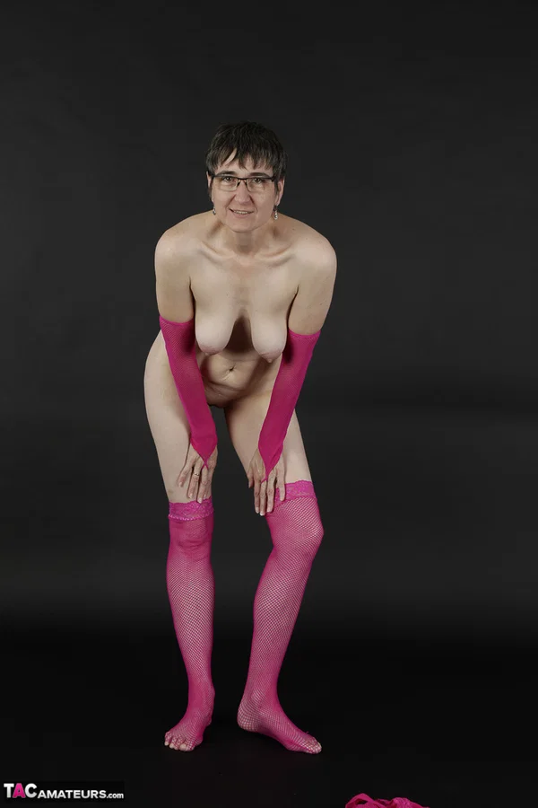 Mature amateur gets naked in pink arm socks and stockings with her glasses on  - Saggy Tits, Mature, Glasses, Short Hair, Lingerie, Amateur, Stockings, Brunette, European  - Photo 14