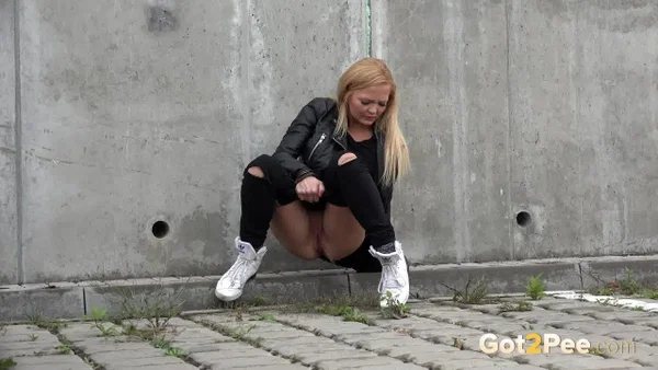 Blonde girl Jena Lovely pulls down black leggings for a pee near an overpass  - Pissing, Babe, Outdoor, Blonde, Leather, Clothed, Undressing, Beautiful, Solo  - Photo 8