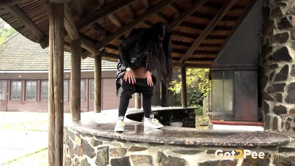 Dark haired girl pisses on the counter of an outdoor bar in an act of revenge  - Pissing, Outdoor, Spreading, Babe, Shaved, Close Up, Pussy, Clothed, Beautiful, Solo  - Photo 13