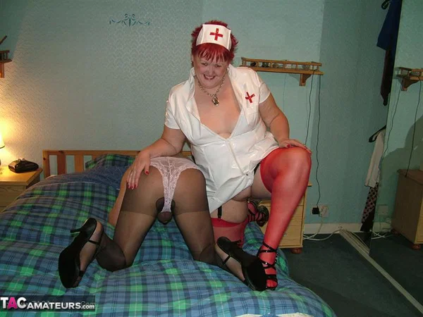 Mature nurse with red hair Valgasmic Exposed indulges in foreplay with a sissy  - Nurse, Mature, Chubby, Latex, BBW, Curvy, Amateur, Thick, Boots, Redhead  - Photo 5