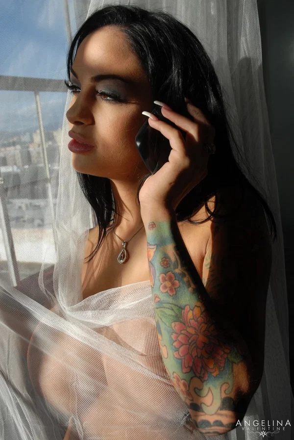 Latina Angelina Valentine talks on the phone as she poses behind the curtain  - Pornstar, Latina, Sexy, Brunette  - Photo 18