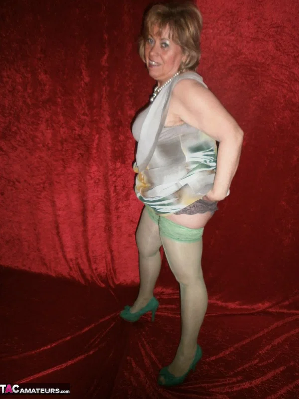 Chubby mature granny Caro in green stockings flashes lace panty cameltoe  - Granny, BBW, Amateur, Stockings, Panties, Big Tits, High Heels, Curvy, Chubby, Thick  - Photo 8